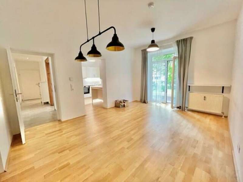 Wohn-Esszimmer mit 2. Zugang zum Garten/Terrasse - Mietwohnung Graz - Bild 1