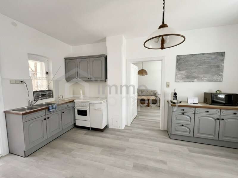 Wohnküche Blick Wohnzimmer - Bungalow Hautzendorf - Bild 1