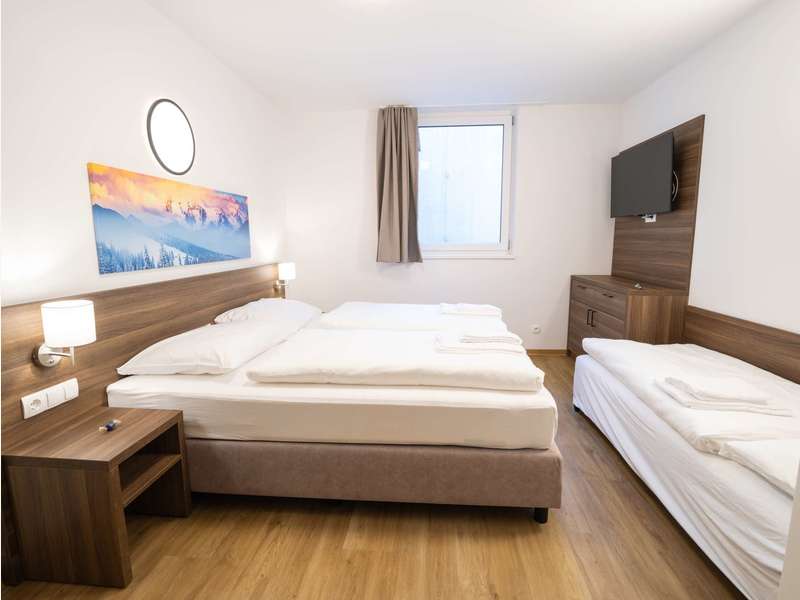Schlafzimmer - Eigentumswohnung Fieberbrunn - Bild 1